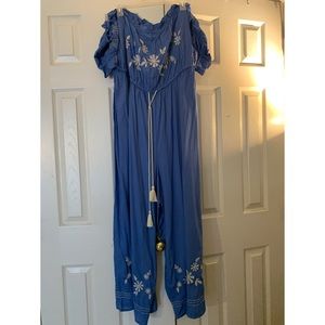 Plus size off the shoulder wide leg jumpsuits.